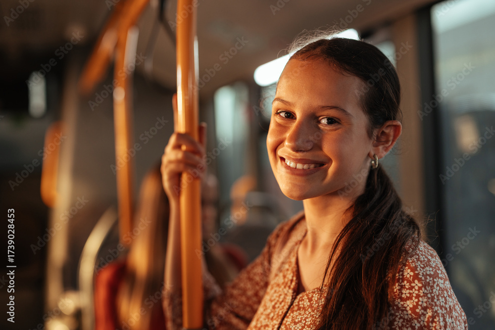 © bernardbodo - Portrait of a girl smiling on a bus with copy space © bernardbodo - Portrait of a girl smiling on a bus with copy space