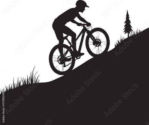 Black silhouette of a person riding a mountain bike uphill