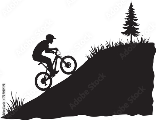 Black silhouette of person on bicycle descending grassy hill