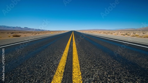 An Empty Desert Highway Stretching into the Horizon Under a Vast Sky