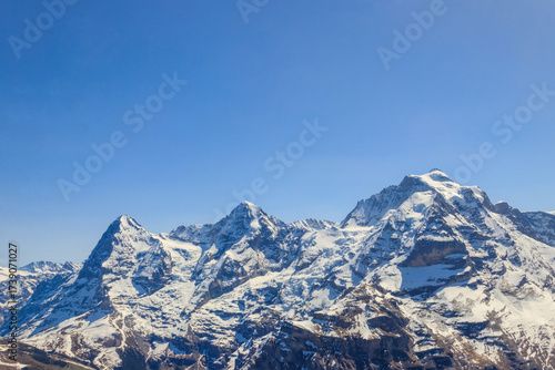 Wallpaper Mural View of three famous Swiss mountain peaks Eiger, Monch and Jungfrau in the Bernese Oberland in Switzerland Torontodigital.ca