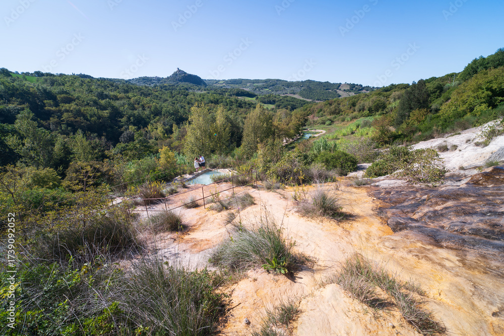 Fototapeta premium Parco naturale dei Mulini, public park with hot springs and dismantled system of grain mills at Bagno Vignoni, Val d'Orcia town in the province of Siena, Italy