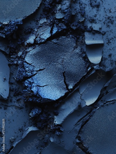Cracked Blue Eye Shadow Texture: This captivating macro image shows a close-up view of cracked blue eye shadow, offering an immersive exploration of textures, shades, and intricate details. 