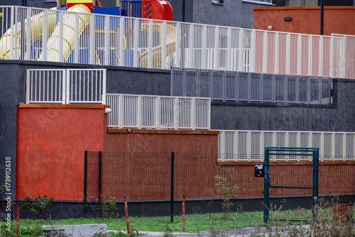 Fencing of the courtyard of an apartment building on an autumn day