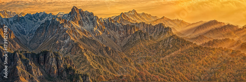 Breathtaking sunset over the rugged mountain landscape with vibrant colors and serene atmosphere