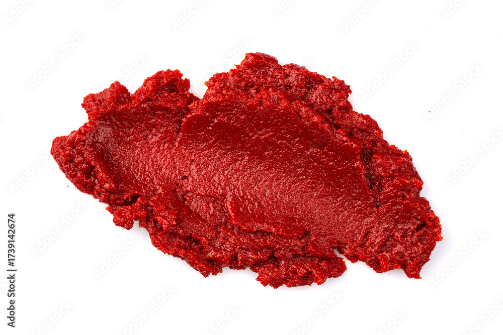 Fototapeta premium Tomato or pepper paste or puree prepared to add flavor to dishes on a white background