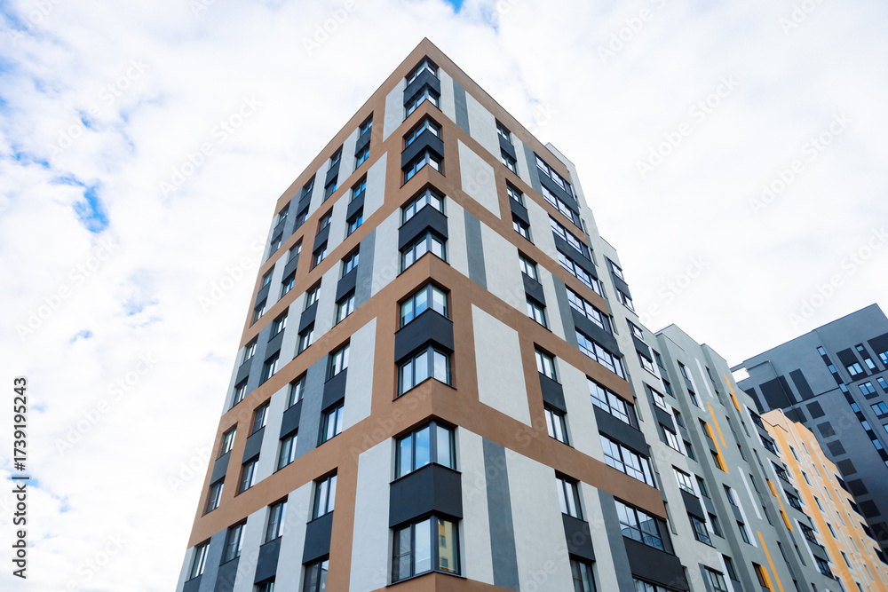 Fototapeta premium A modern residential complex: monolithic buildings, comfort class, developed infrastructure, proximity to nature, cozy courtyards, playgrounds.