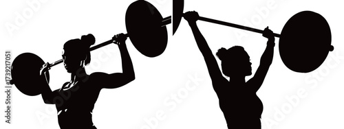 Two female athletes perform weightlifting exercises in a gym. They are focused and strong, showcasing their dedication and fitness during training.