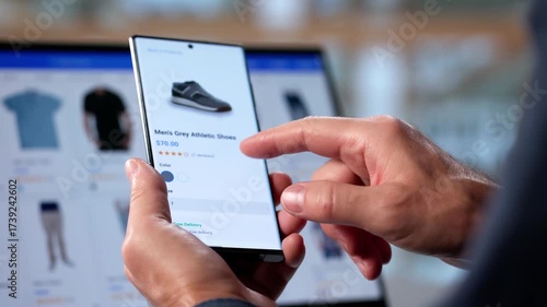Man Holding Smartphone Adding Shoes