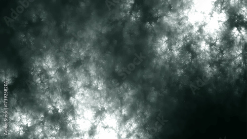 Abstract cloudy texture in black, gray, and white tones with a smoky and misty atmosphere. Storm clouds, fog, or cosmic nebula effects. Light and shadow dramatic, moody, and textured background
