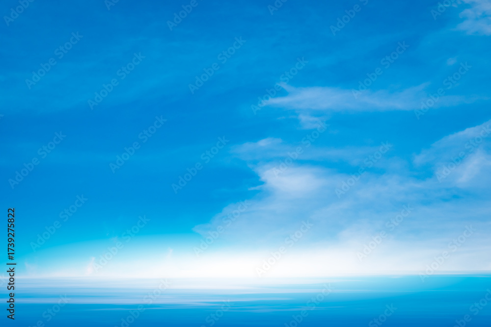 Obraz premium Panorama of cloud clear sky background for summer vacation concept at ocean and summer sea water with sunlight of beautiful cloudy 
