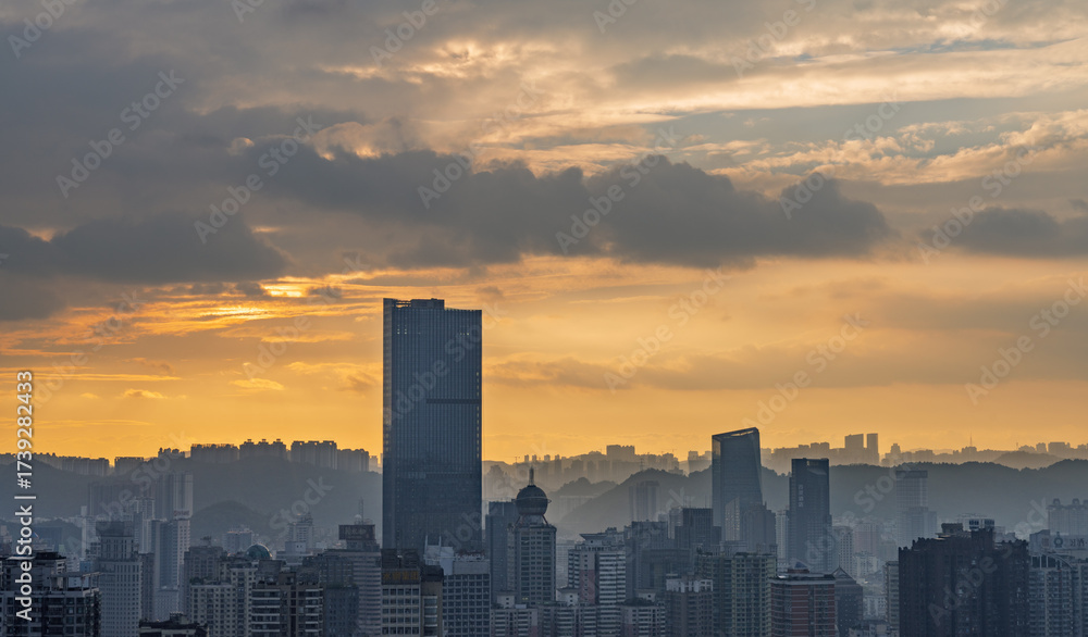 Fototapeta premium Sunset silhouette of Guiyang's cityscape