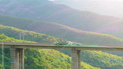AI-Powered Driverless Cargo Truck with Trailer on Highway Futuristic Autonomous Vehicle Drone Aerial Footage with Digital Scanning Effects