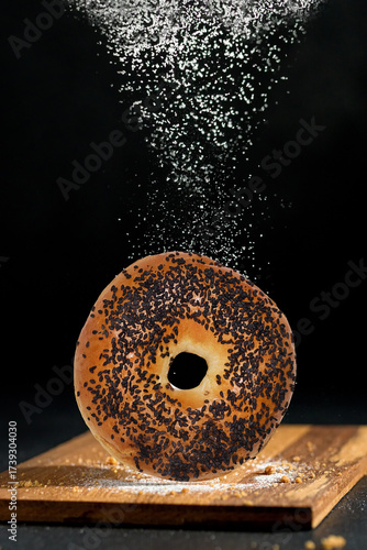 Black sesame bagels sprinkled with flour and sugar give a delicious feeling.
