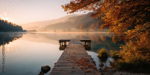 A tranquil lakeside scene with a wooden dock extending