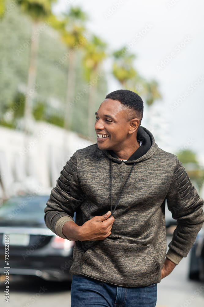 Fototapeta premium Charming african american man enjoys a sunny autumn day in vibrant Miami