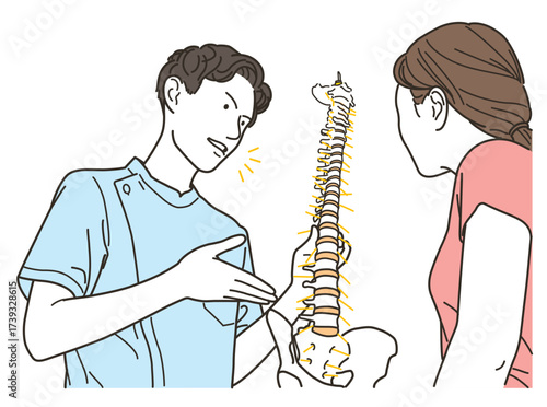 男性整体師が患者に背骨を使って説明する