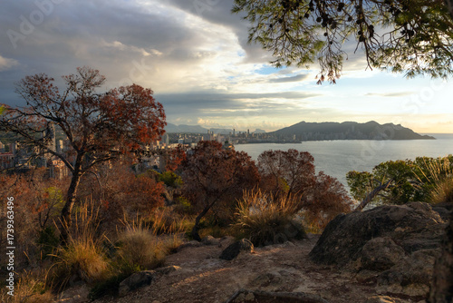 Panoramic view of a modern coastal city with high-rise buildings along the Mediterranean Sea.