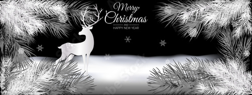  white branches of a pine tree and two deers on a black  background.Close-up, long