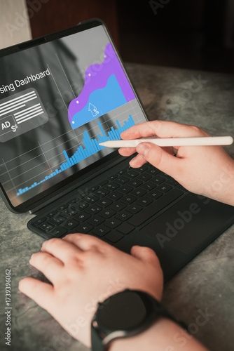 Analyst uses digital tablet and dashboard for data business analysis. Data Management System concept. Technology finance, sales and marketing operations.