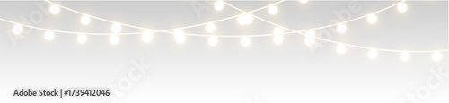 Shiny garland outlines New Year banner. Circle of light forms magical border. Soft yellow bulbs hang on thread. Twilight glow fills joyful evening sky