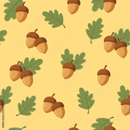 Seamless autumn background with acorns and oak leaves on yellow