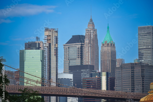 40 Wall Street (The Trump Building): This is the slender, historic skyscraper with the prominent green/gold pyramid-shaped roof and spire. Lower Manhattan skyline in New York City