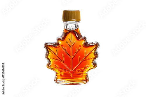 Rich amber maple syrup elegantly bottled in a charming leaf-shaped glass, perfect for gourmet breakfast delights.
