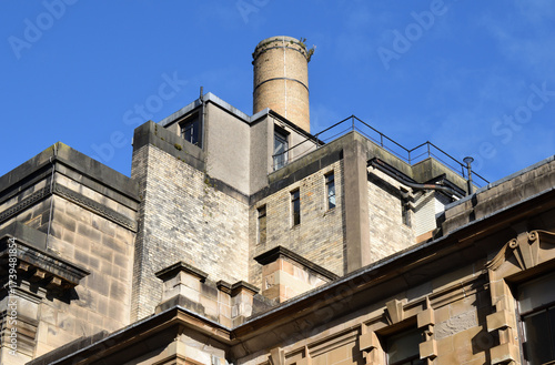 Industrial Brick Chimney seen above Victorian City Buildings 