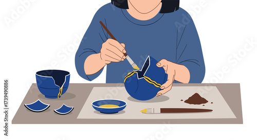 Person repairing a broken blue ceramic bowl with gold lacquer.
