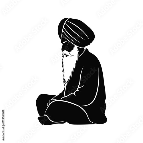 Silhouette of a wise sikh elder with a long beard and turban meditating in a seated position