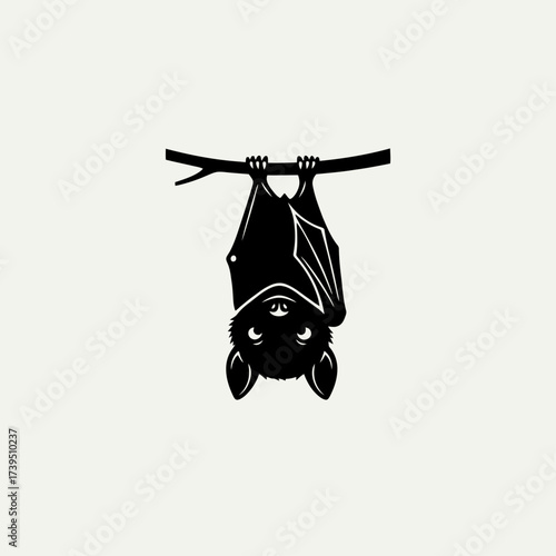 Enchanting Bat Silhouette: A minimalist silhouette of a charming bat hangs upside down from a slender branch, radiating a sense of serenity and mystery.