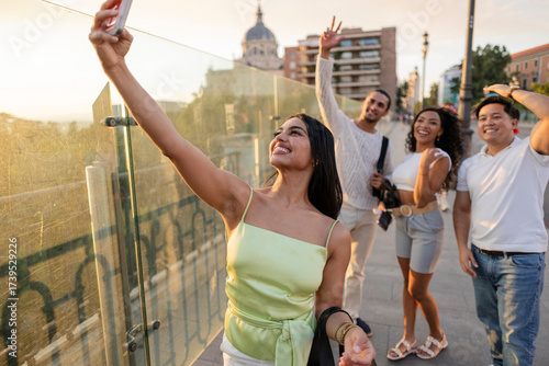 Diverse friends taking selfie during city travel adventure
