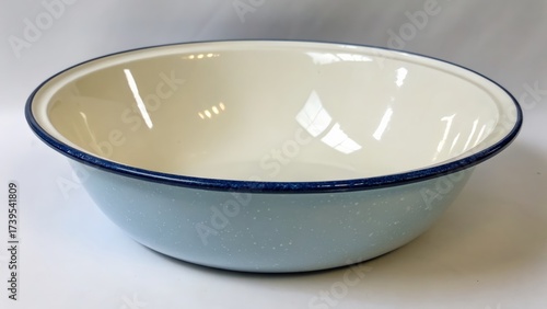 Round ceramic bowl with light blue exterior and white interior for kitchen use