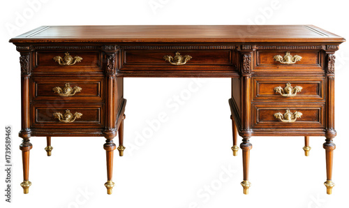 Elegant antique wooden desk with multiple drawers and ornate brass handles, isolated on white.