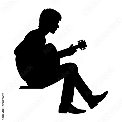 Silhouette of rock musician playing guitar