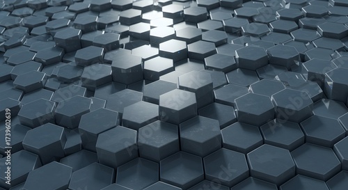 Abstract background of dark metallic hexagonal shapes creating a textured 3D surface with varying heights and reflective highlights.