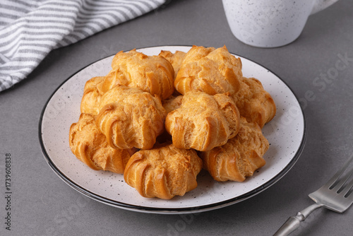 Freshly baked pastries arranged on a plate ready for enjoyment during a cozy afternoon