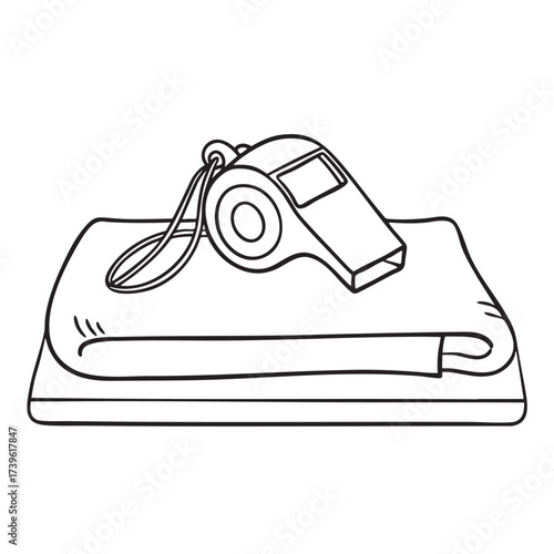 A whistle resting next to a folded towel on a locker room bench