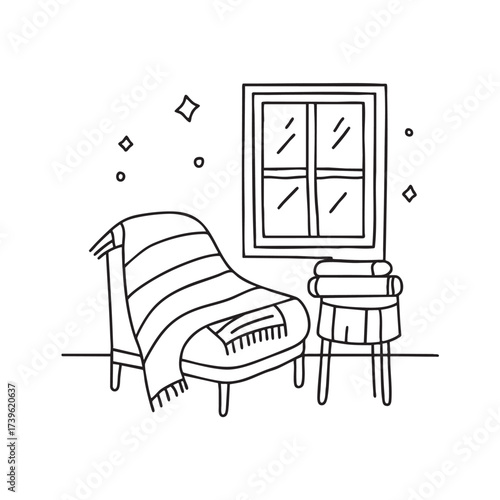 A window near a chair with a folded blanket draped over it