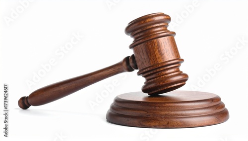 Describe a polished wooden judge’s gavel resting on a sound block. Highlight its classic design, rich finish, and symbolic role in courtroom authority, rulings, and legal proceedings.