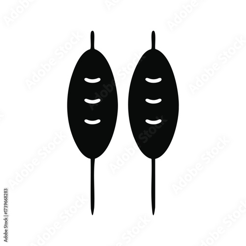 Two meat skewers on sticks, grilling food.