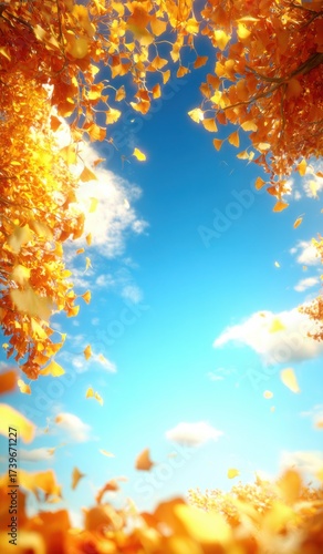 Bright orange leaves dance in the wind under a clear blue sky on a sunny autumn day