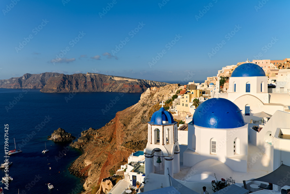 Fototapeta premium Santorini Greece. Oia. Blue domed church at sunrise