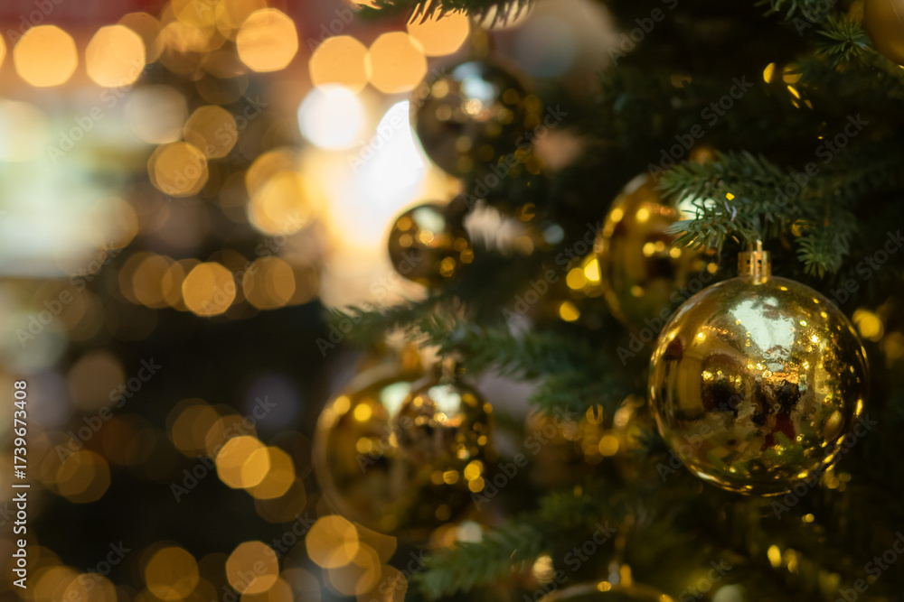 Fototapeta premium Christmas tree with golden balls, spruce decoration and abstract holiday card, bright noel light celebration.