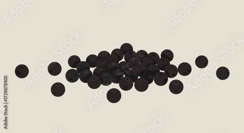A cluster of round dark objects seemingly berries scattered across a flat surface