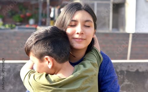 Happy loving little latin siblings.