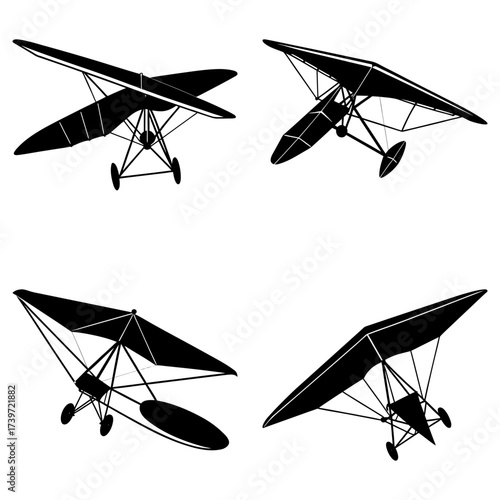 Four black silhouette illustrations of hang gliders in different positions on a white background view