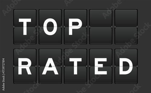 Black color analog flip board with word top rated on gray background