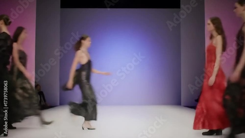 Models elegantly showcasing stylish dresses on a fashion runway with a vibrant backdrop